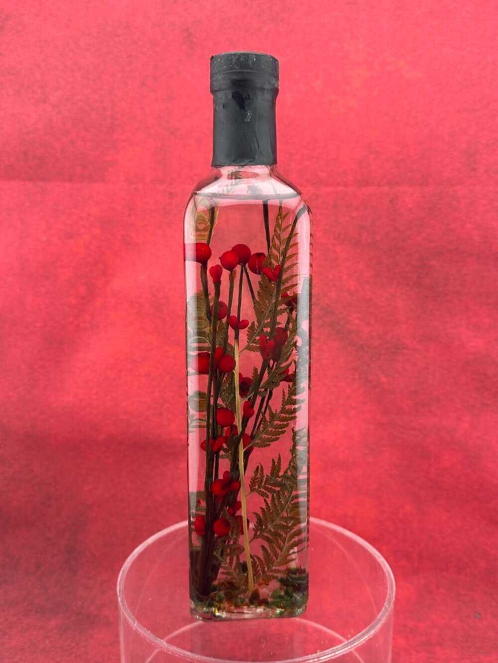 DECORATIVE BOTANICAL BOTTLE with RED BERRIES AND FERN IN LIQUID SEALED 10 " TALL